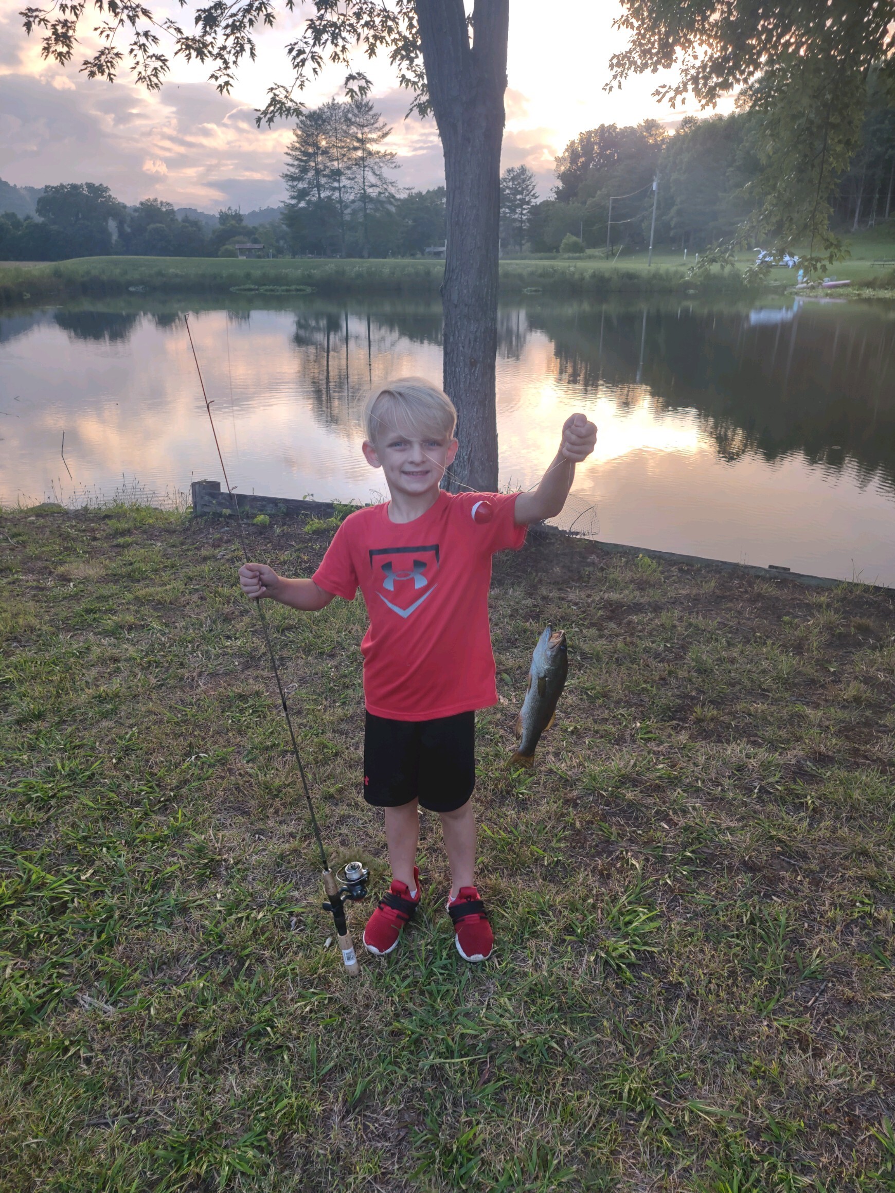 Deerwoode Reserve | Young boy, fishing rod, lake.