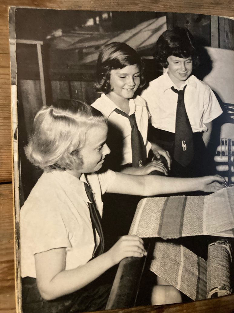 Deerwoode Reserve | Three girls examining a book.