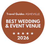 Circular brown award badge: Travel Guides Asheville — Best Wedding & Event Venue 2026, with five stars.